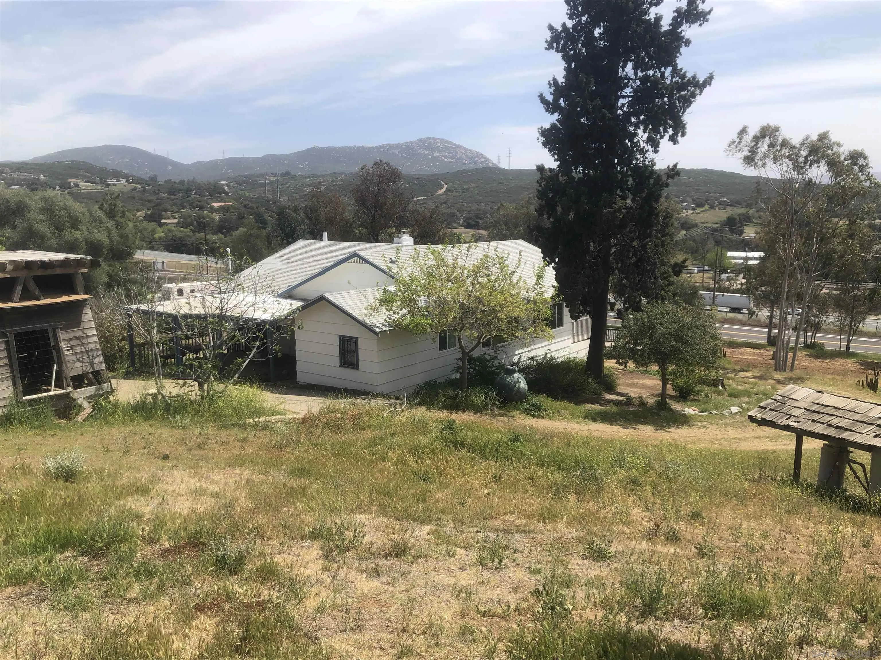 3962 Willows Road Alpine, CA 91901 - Photo 4 of 13 a view of a house with a yard and sitting area