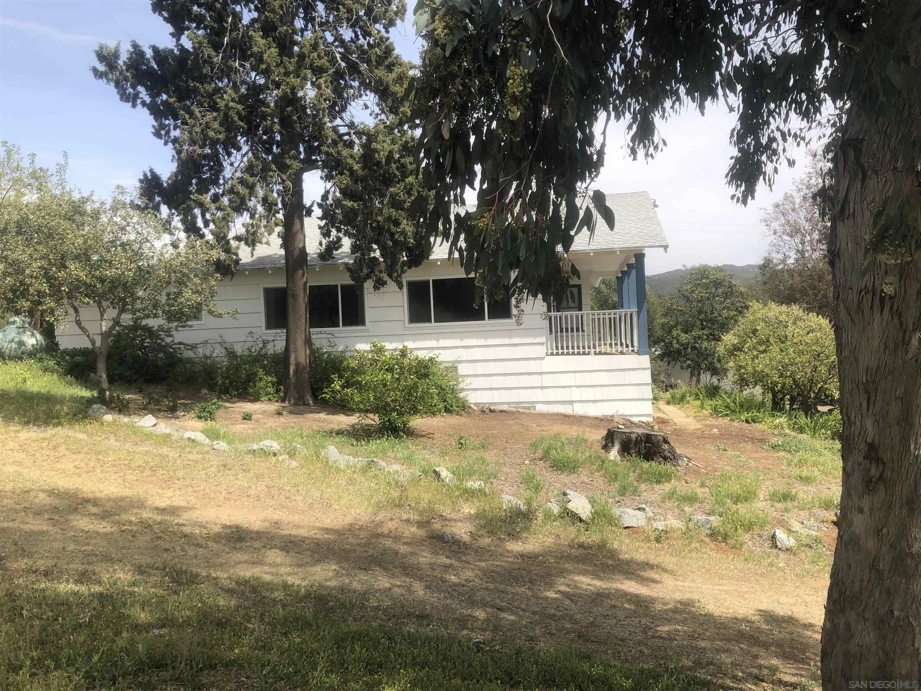 3962 Willows Road Alpine, CA 91901 - Photo 6 of 13 a front view of a house with garden