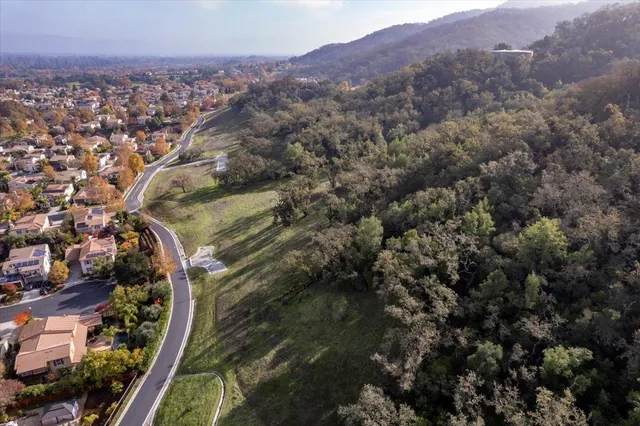 an aerial view of residential house and outdoor space