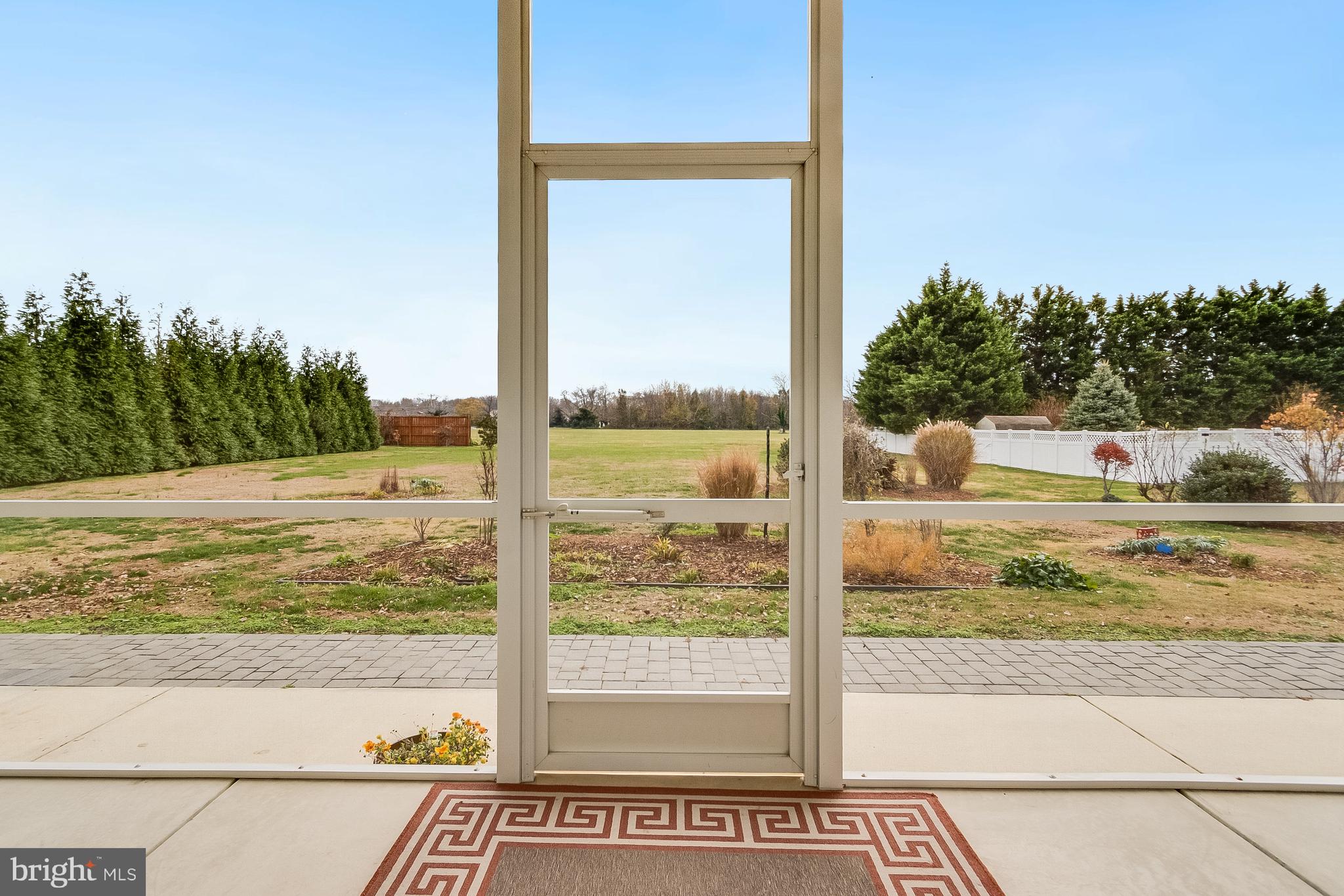 34170 Clay Road Lewes, DE 19958 - Photo 20 of 66 Screened porch overlooking backyard