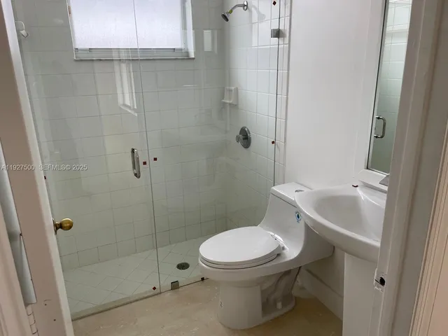 a bathroom with a toilet and a bathtub
