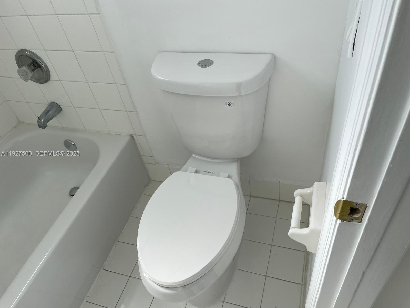 15964 Southwest 139th Street Miami, FL 33196 - Photo 17 of 22 a bathroom with a toilet and a bathtub