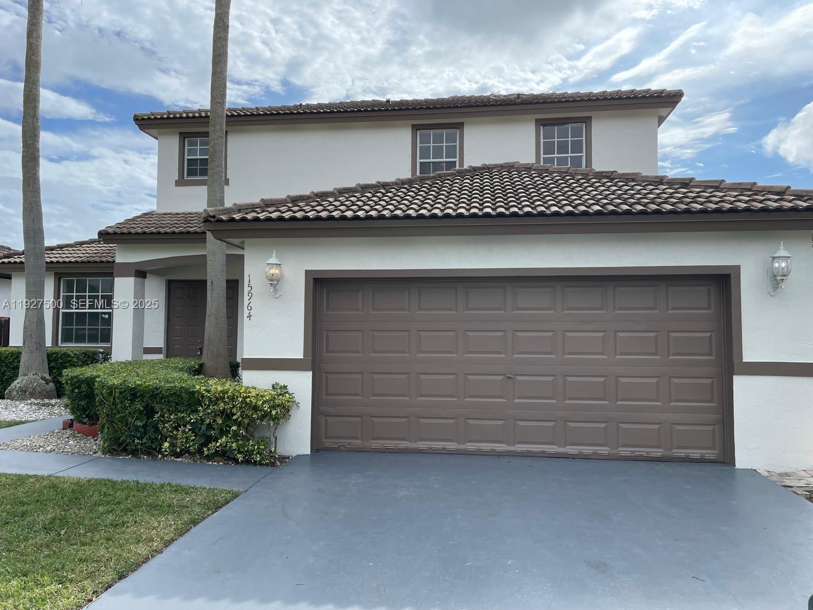 15964 Southwest 139th Street Miami, FL 33196 - Photo 2 of 22 front view of a house