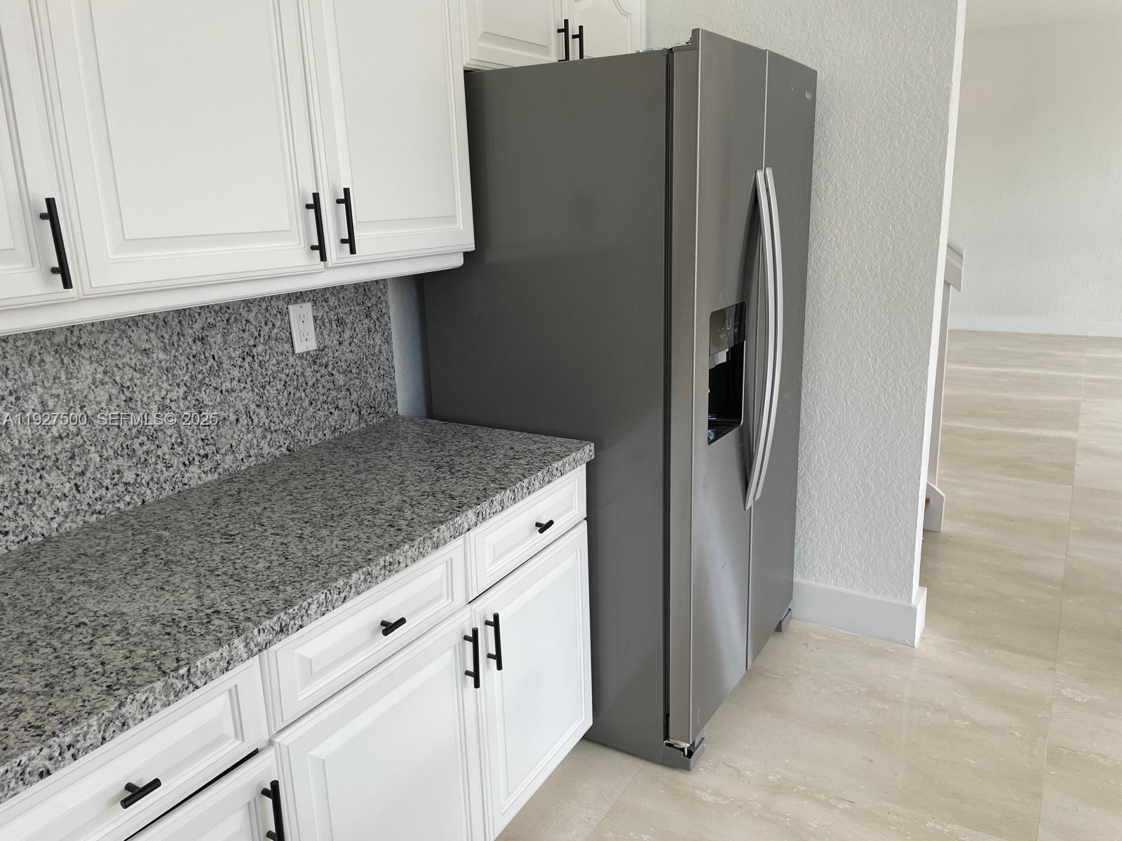 15964 Southwest 139th Street Miami, FL 33196 - Photo 10 of 22 a kitchen with cabinets and stainless steel appliances