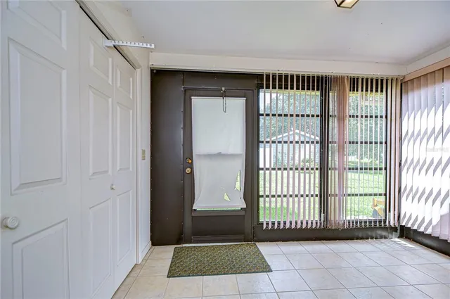 a bedroom with a bed and a chair