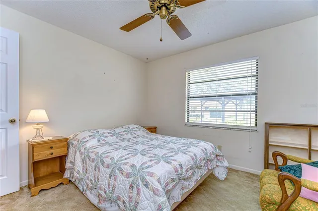 a bed room with a bed and a lamp