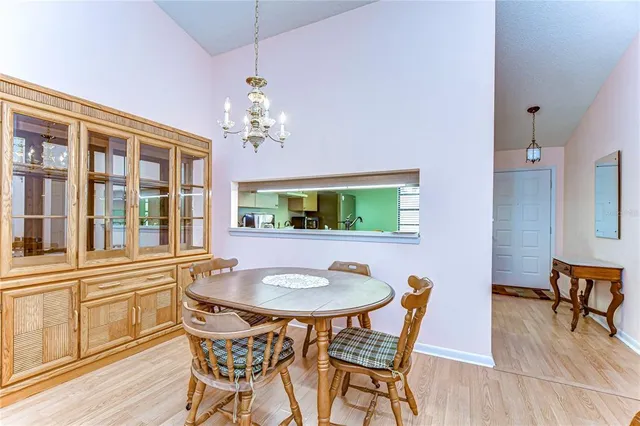 a dining room with furniture and wooden floor