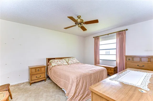 a bedroom with a bed and a cabinets