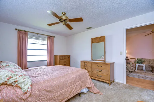 a bathroom with a toilet a sink and a mirror