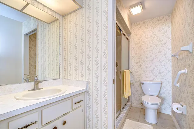 a bathroom with a toilet and a sink