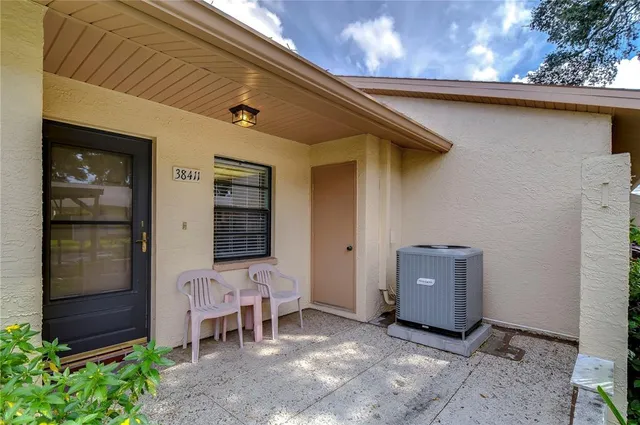 a front view of a house with outdoor seating
