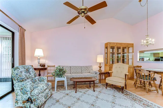 a living room with furniture chandelier and a chandelier