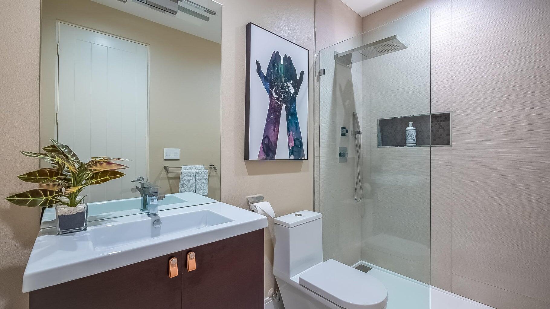 2 Dominion Court Rancho Mirage, CA 92270 - Photo 8 of 40 a bathroom with a toilet sink and mirror