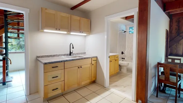 a kitchen with a sink and cabinets