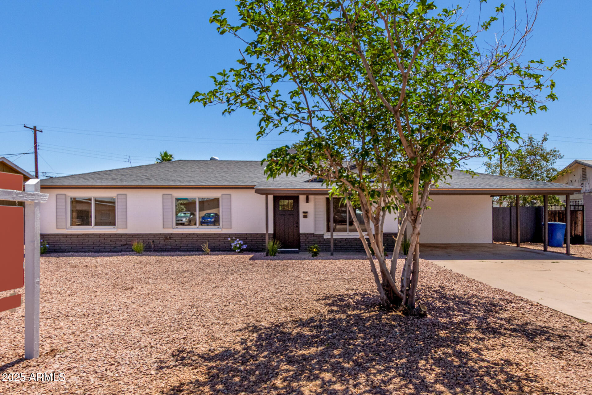 1539 West 5th Street Tempe, AZ 85281 - Photo 1 of 12 a front view of a house with a yard covered with trees