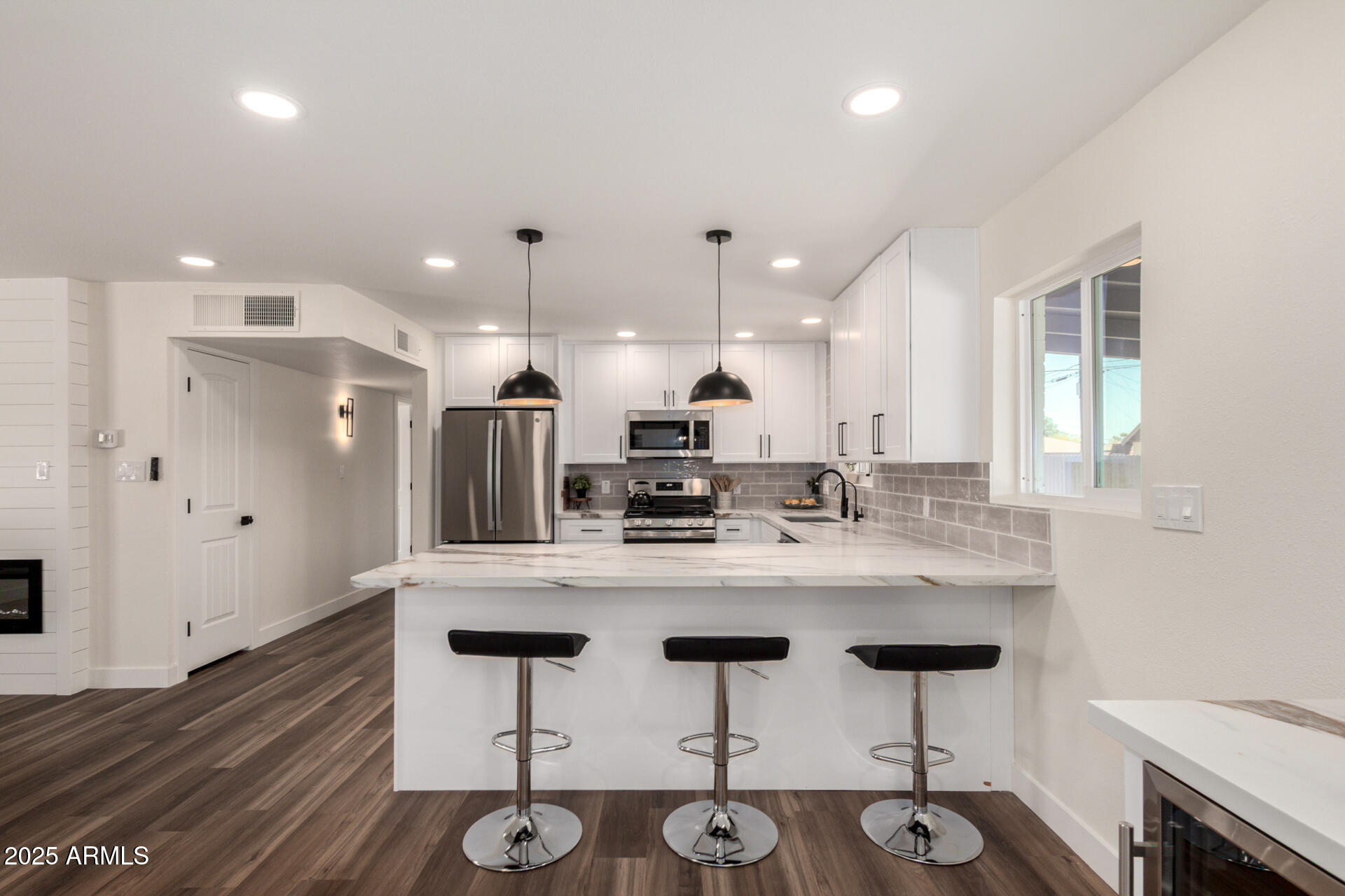 1539 West 5th Street Tempe, AZ 85281 - Photo 5 of 12 a kitchen with stainless steel appliances kitchen island granite countertop a sink and cabinets
