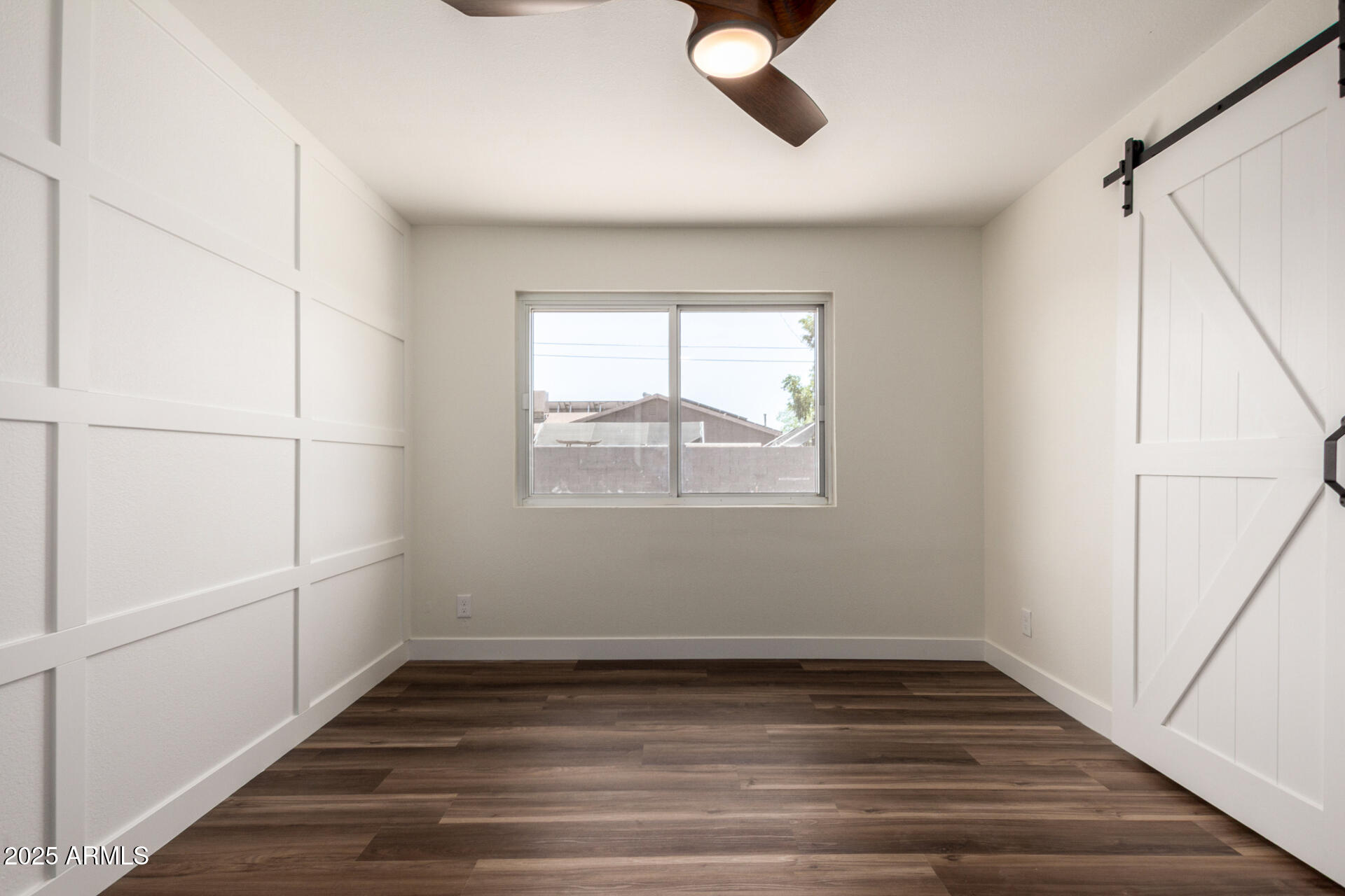 1539 West 5th Street Tempe, AZ 85281 - Photo 8 of 12 a view of an empty room with wooden floor and window