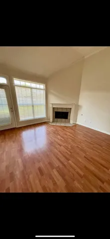 a view of kitchen with cabinets