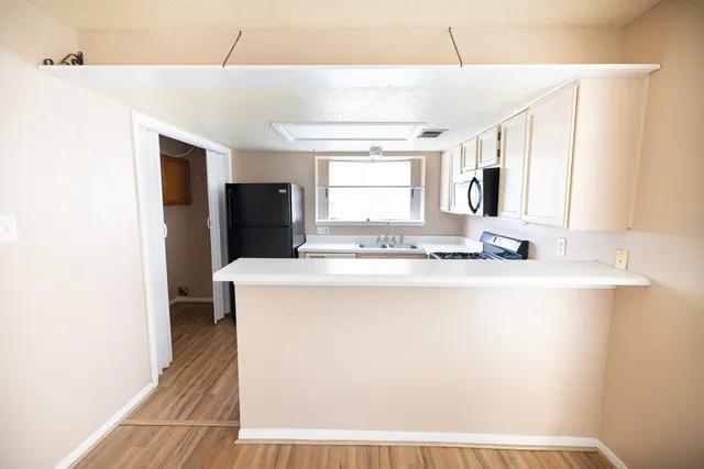 a bathroom with a sink a mirror and a bathtub