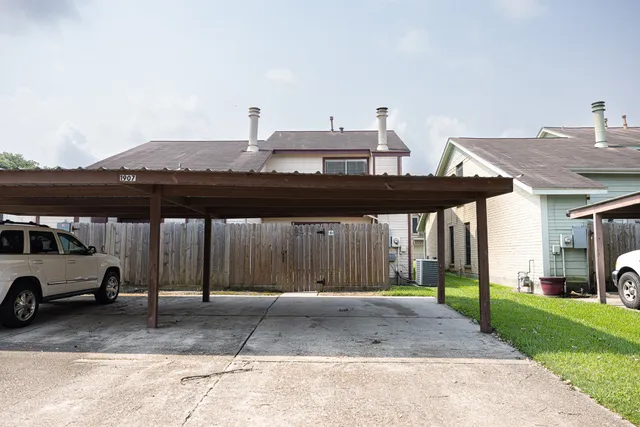 a view of a car parked in front of a house