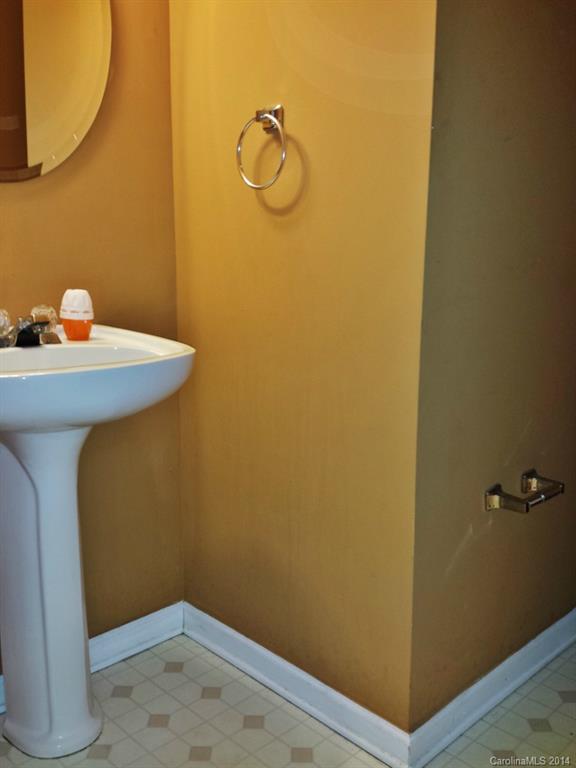 11414 Gold Pan Road Charlotte, NC 28215 - Photo 12 of 24 a bathroom with a sink and vanity