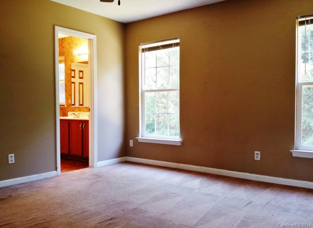 11414 Gold Pan Road Charlotte, NC 28215 - Photo 13 of 24 an empty room with windows