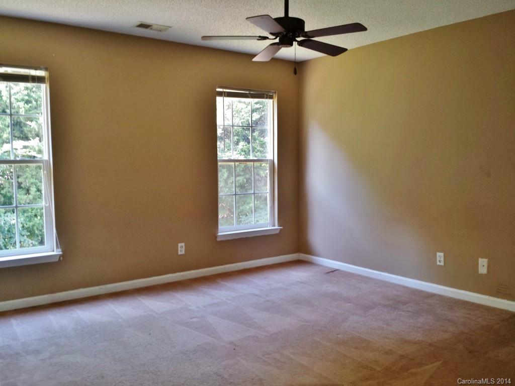 11414 Gold Pan Road Charlotte, NC 28215 - Photo 14 of 24 an empty room with windows and fan