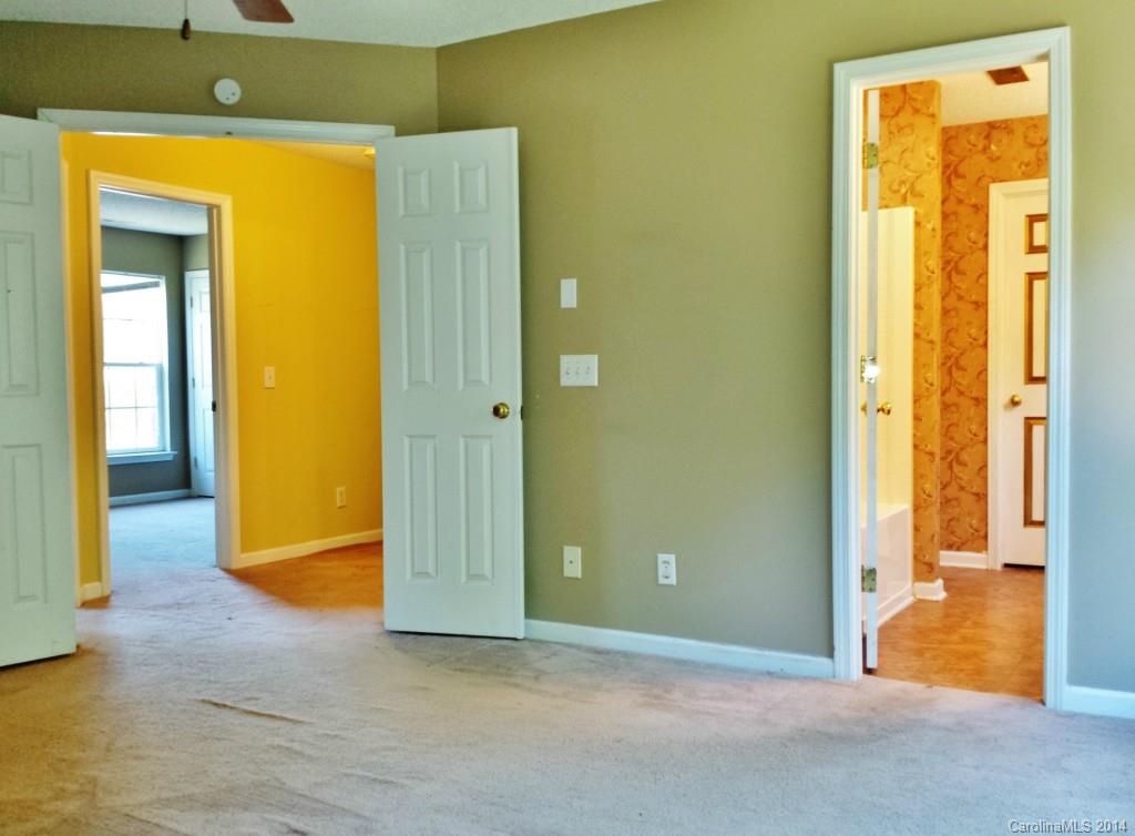 11414 Gold Pan Road Charlotte, NC 28215 - Photo 15 of 24 an empty room with a door
