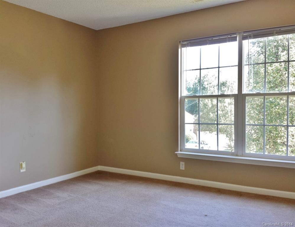 11414 Gold Pan Road Charlotte, NC 28215 - Photo 20 of 24 an empty room with a window