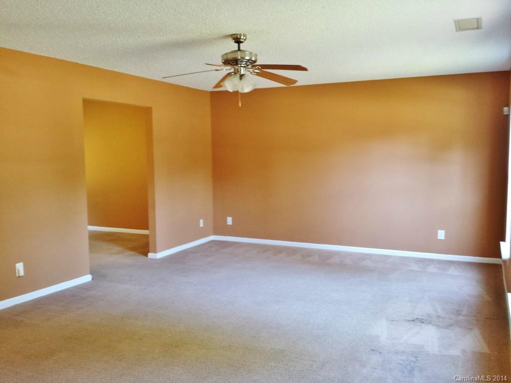 11414 Gold Pan Road Charlotte, NC 28215 - Photo 3 of 24 a view of an empty room with a window