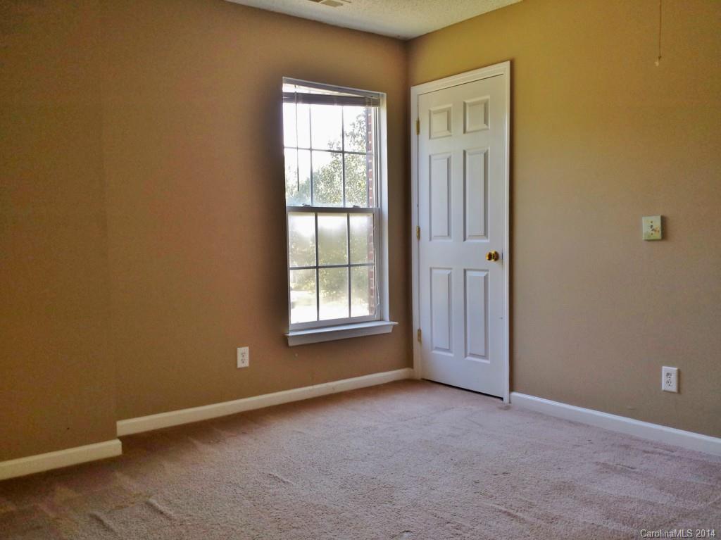 11414 Gold Pan Road Charlotte, NC 28215 - Photo 23 of 24 an empty room with windows