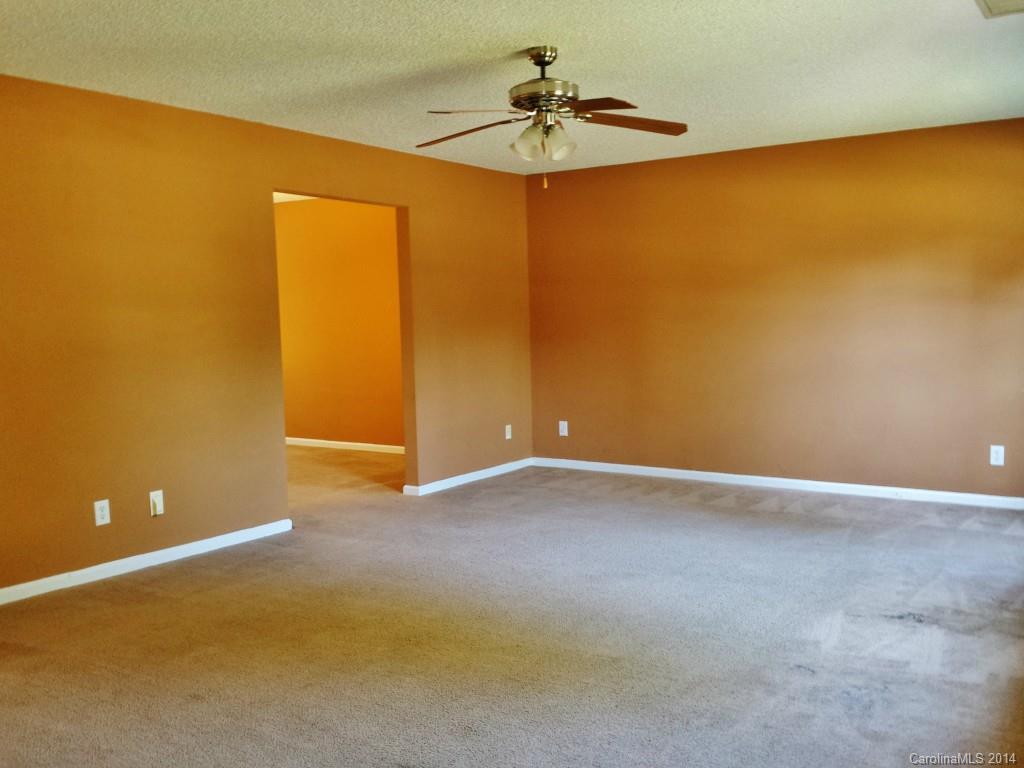 11414 Gold Pan Road Charlotte, NC 28215 - Photo 5 of 24 a view of an empty room with a window