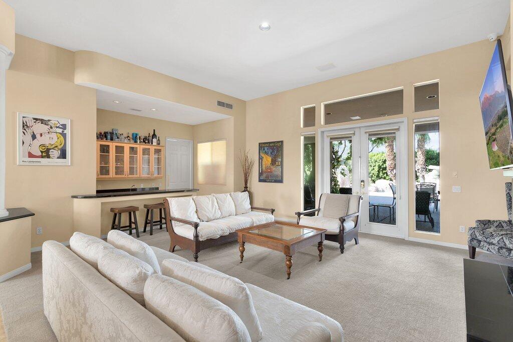 8 MacBeth Court Rancho Mirage, CA 92270 - Photo 5 of 46 a living room with furniture and a table