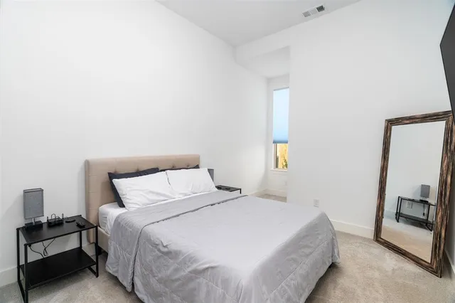 a view of an empty room and a window