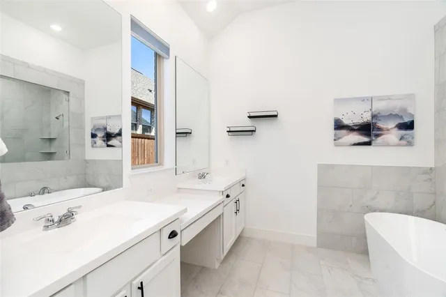 a spacious bathroom with a bathtub sink and toilet