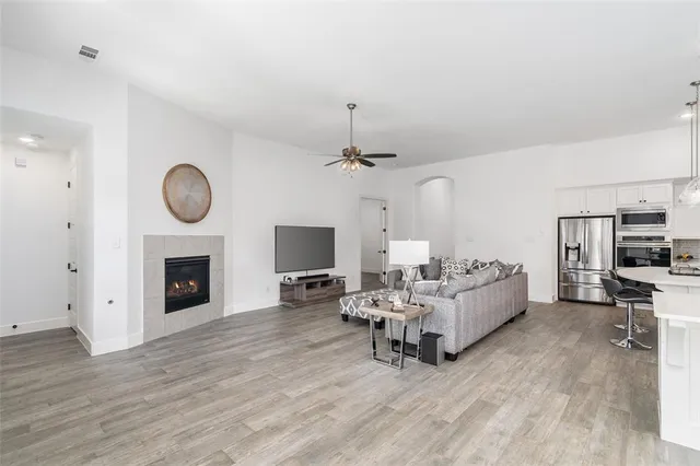 a living room with furniture and a fireplace