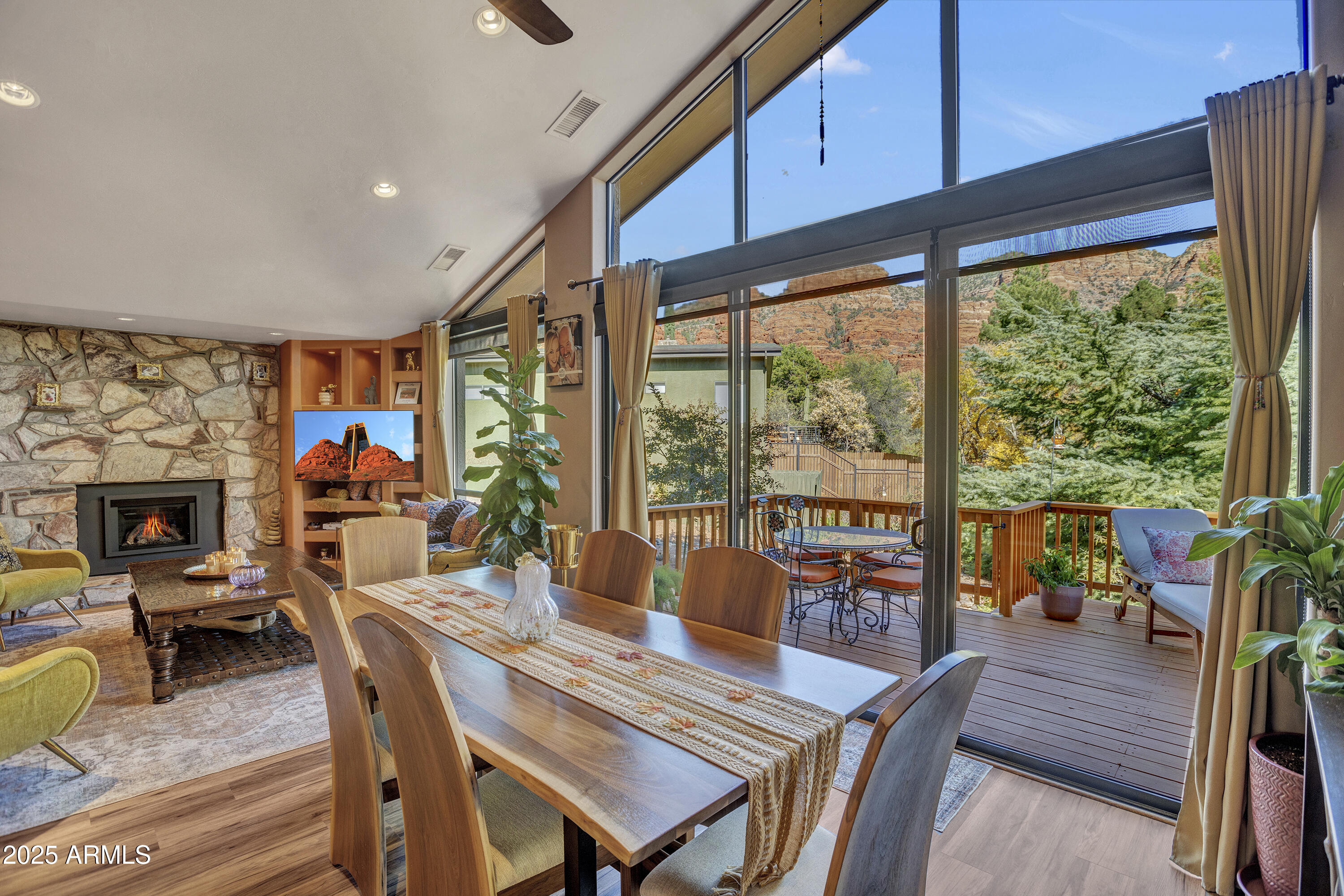 a dining room with furniture water view and a fireplace