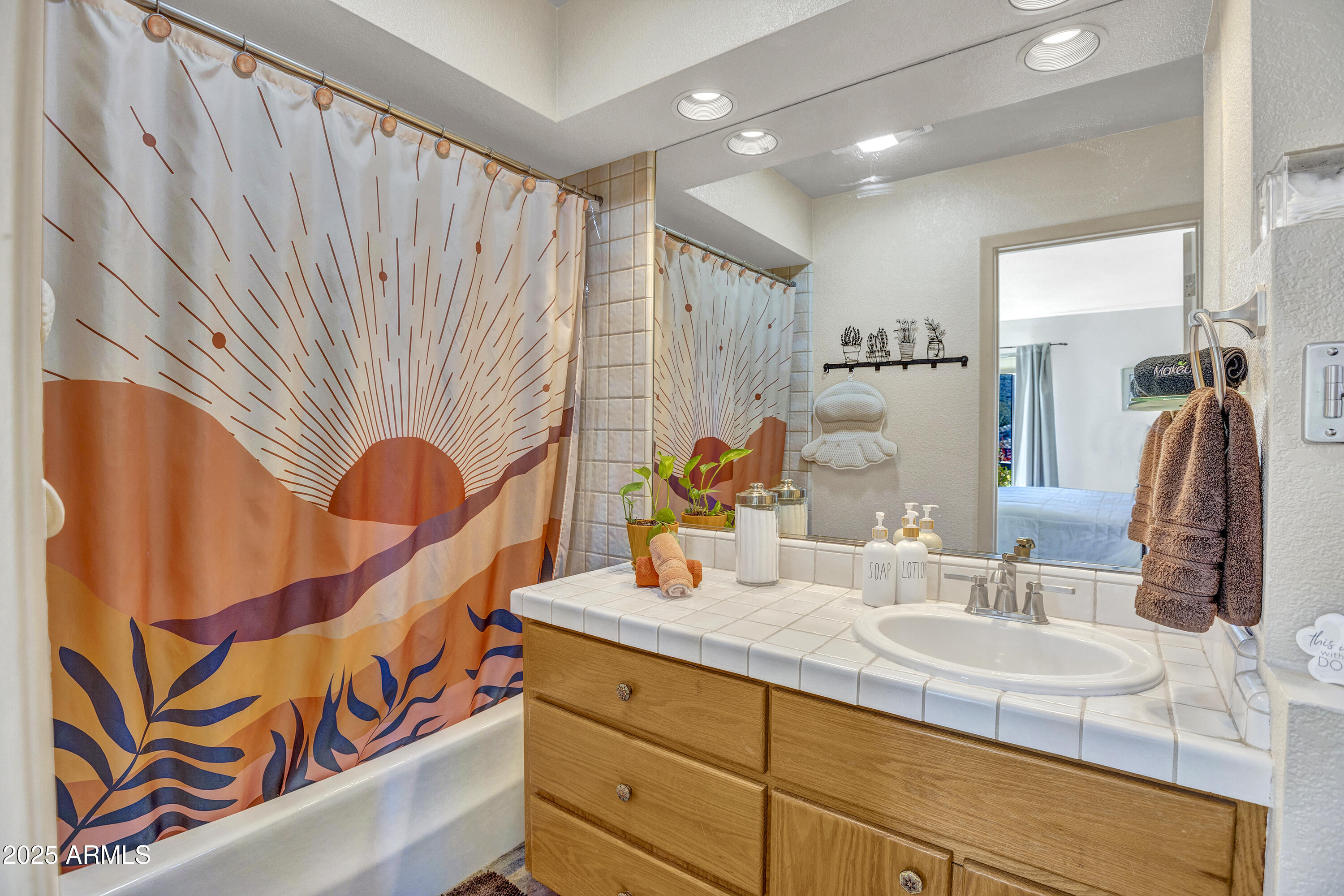 30 Box Canyon Road Sedona, AZ 86351 - Photo 18 of 30 a bathroom with a sink a mirror and a shower curtain