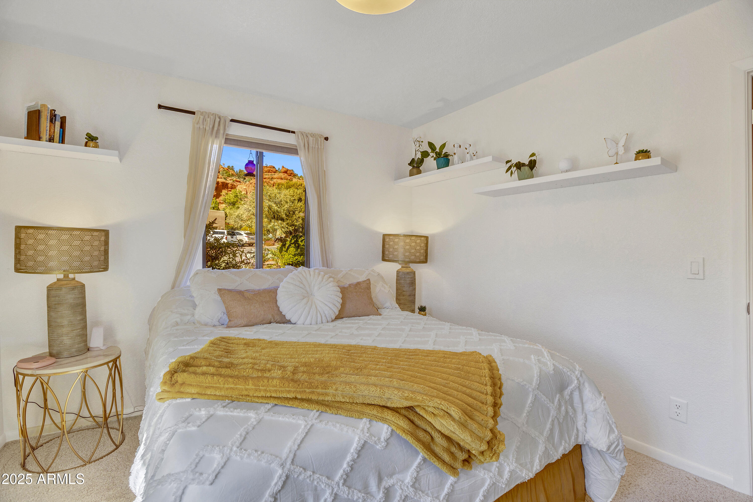 30 Box Canyon Road Sedona, AZ 86351 - Photo 19 of 30 a bedroom with a bed and wooden floor