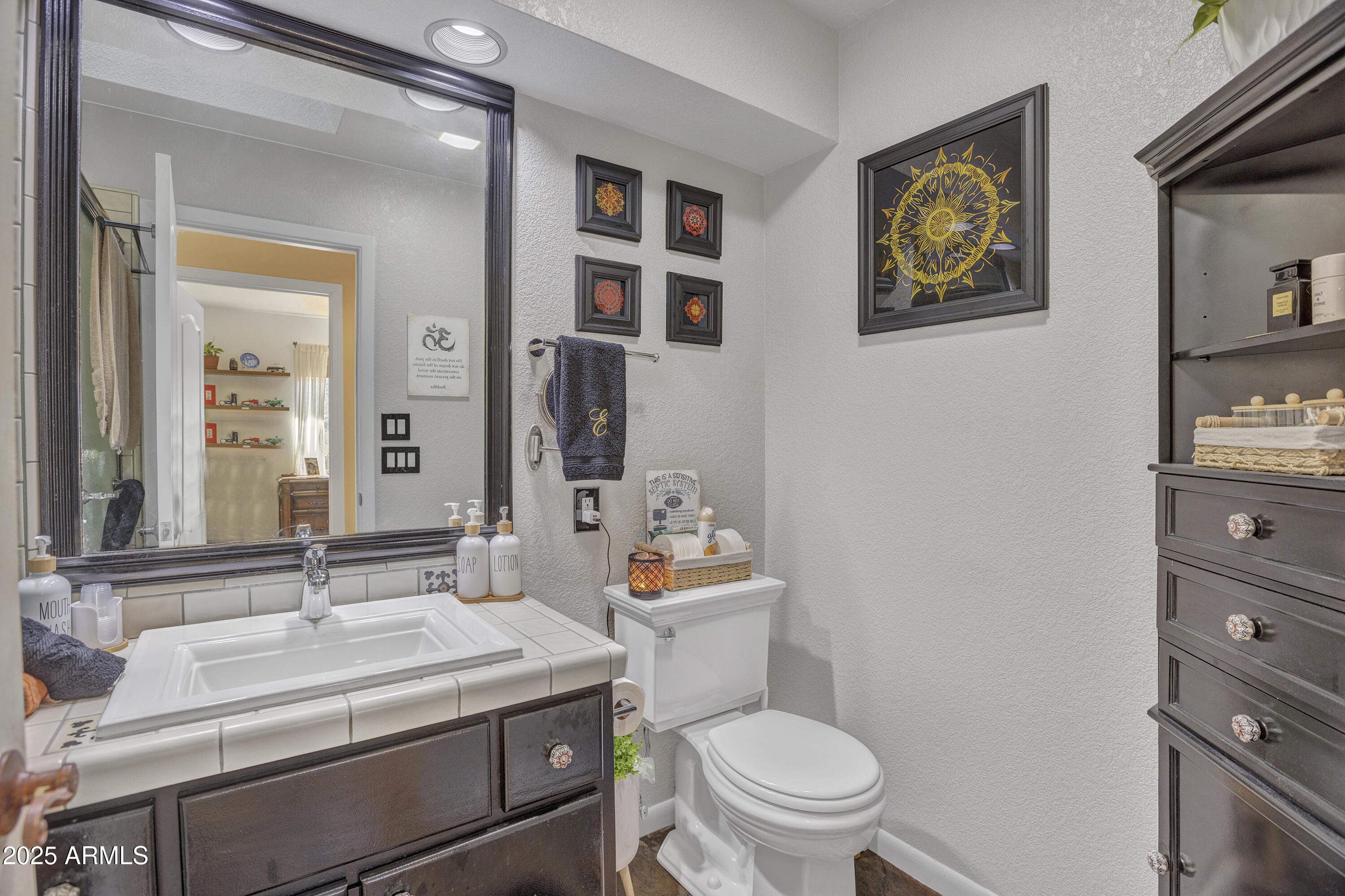 30 Box Canyon Road Sedona, AZ 86351 - Photo 20 of 30 a bathroom with a sink a toilet and a mirror
