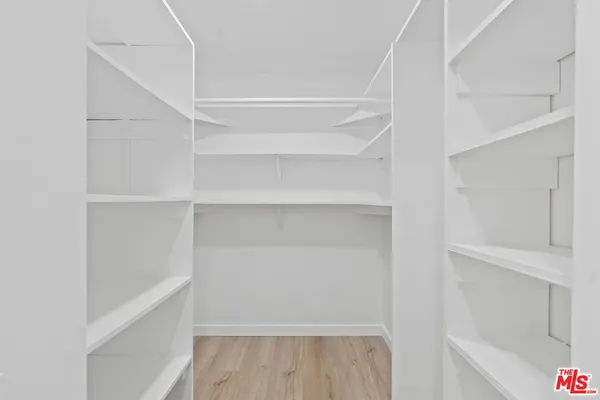 a bathroom with a shower and a sink