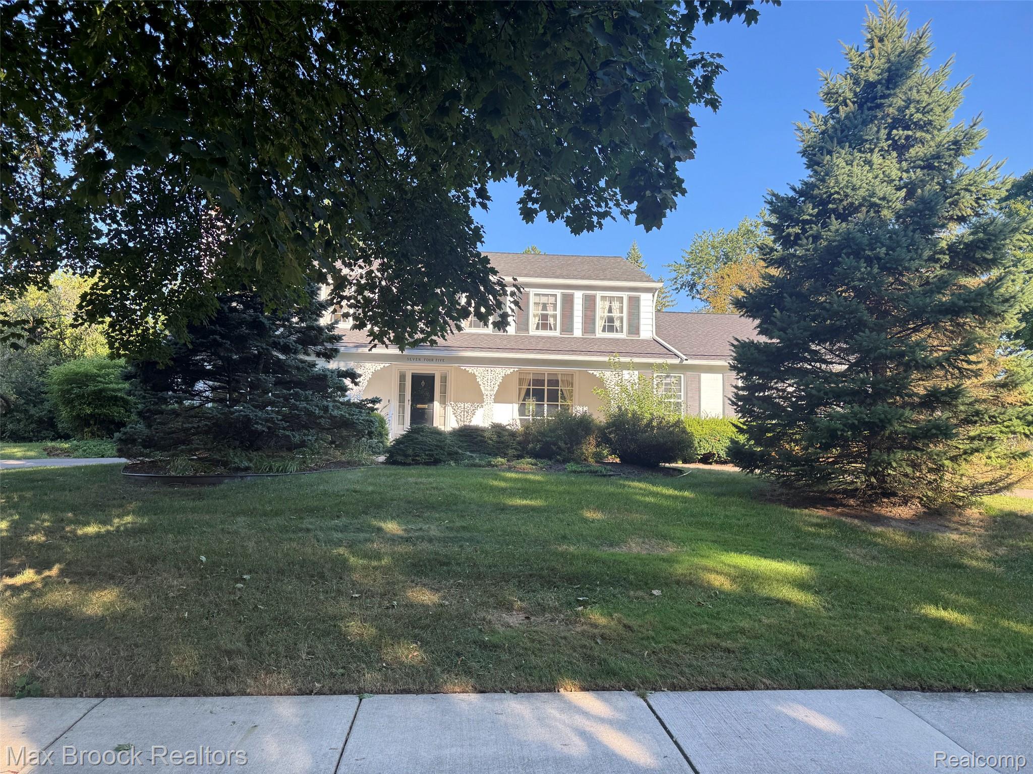 745 Overhill Road Bloomfield Hills, MI 48301 - Photo 1 of 1 Traditional architectural style with a covered front porch, decorative porch columns, and a dormer window