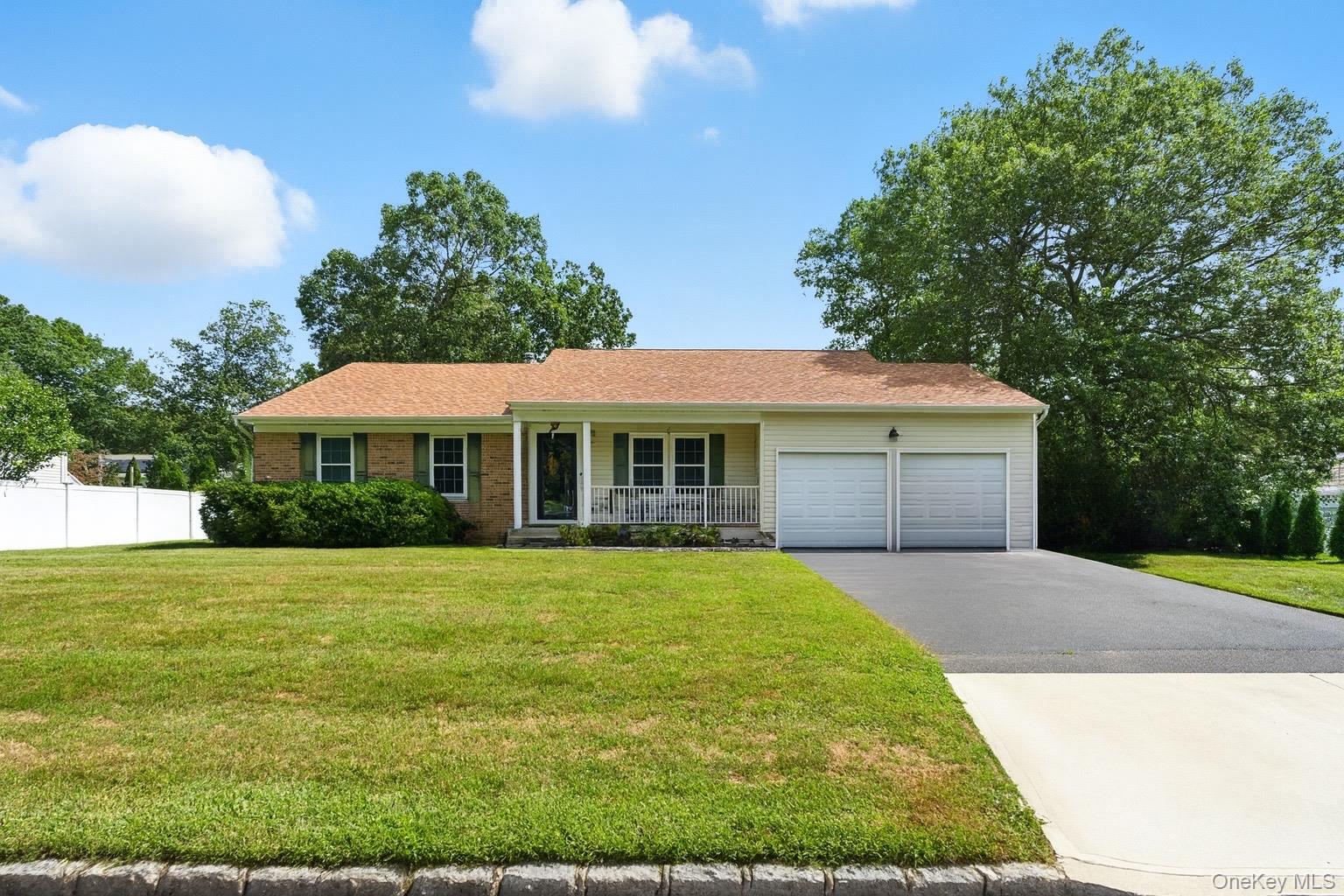 25 Timber Ridge Drive Coram, NY 11727 - Photo 1 of 1 a front view of a house with yard