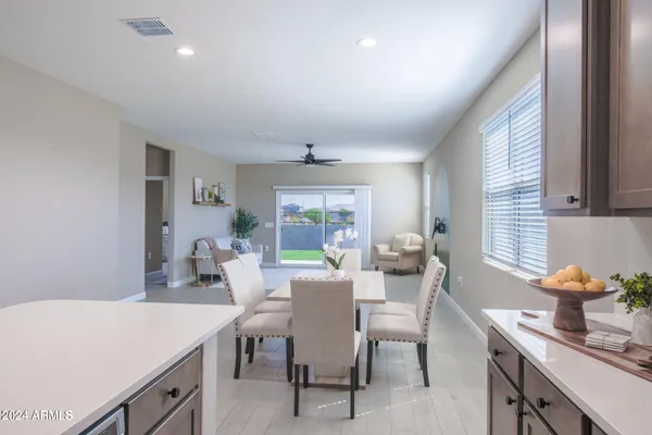 a view of a dining room with furniture window and outside view