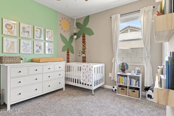 a bedroom with furniture and a window