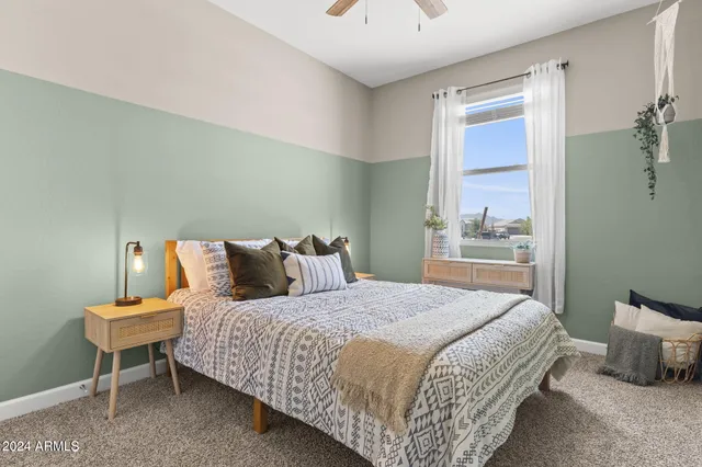 a bedroom with a bed and a table