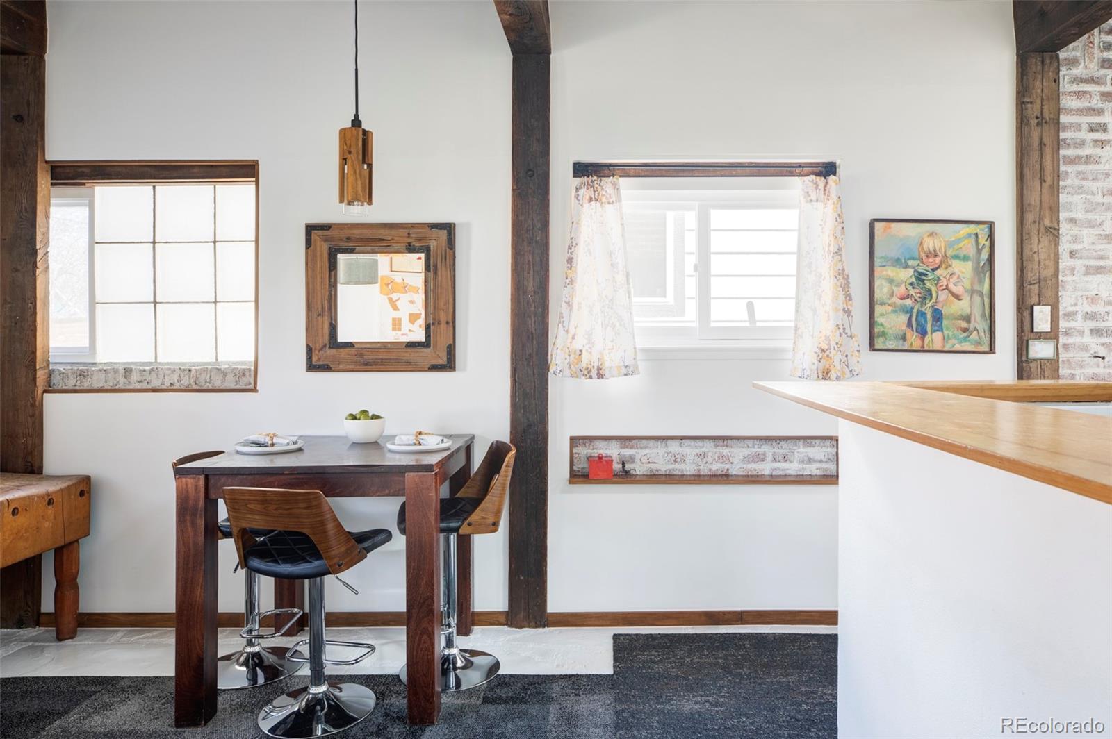 3733 Franklin Street Denver, CO 80205 - Photo 19 of 29 a view of a room that has a window and chairs