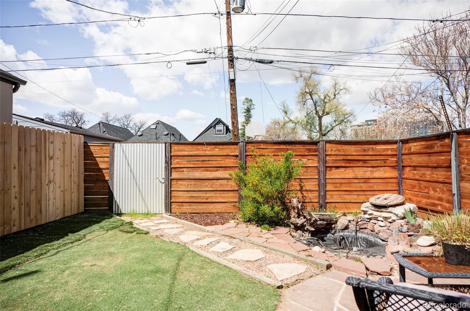 3733 Franklin Street Denver, CO 80205 - Photo 28 of 29 a front view of a house with a yard