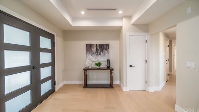 a kitchen with sink attached with living room