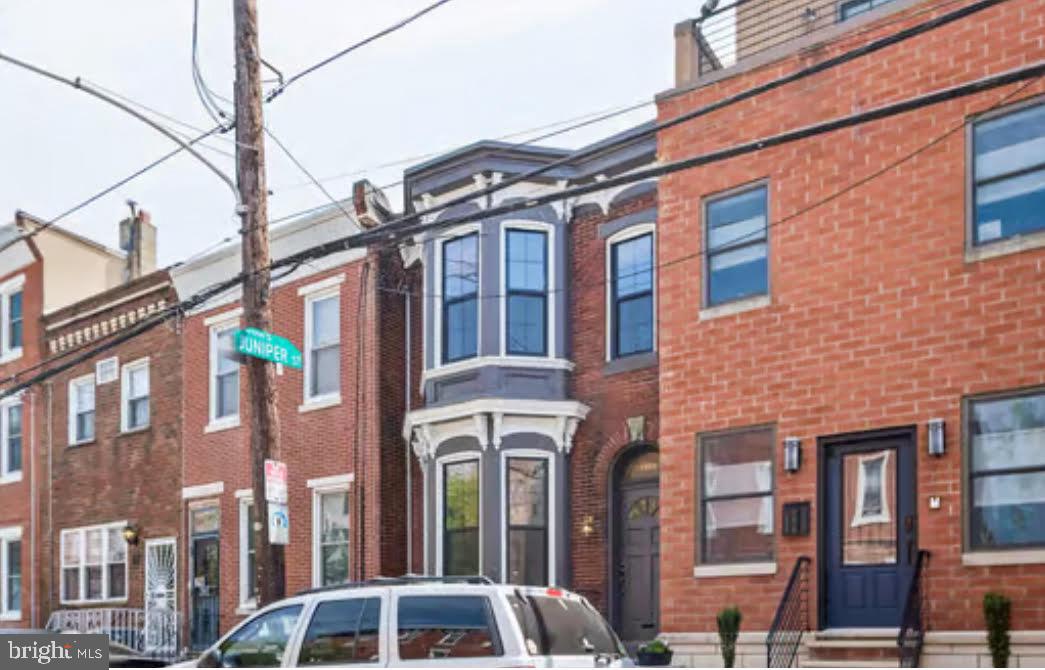 1318 Wharton Street Philadelphia, PA 19147 - Photo 1 of 1 a front view of a multi story residential apartment building